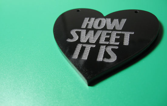 How sweet it is acrylic laser cut charm on green background